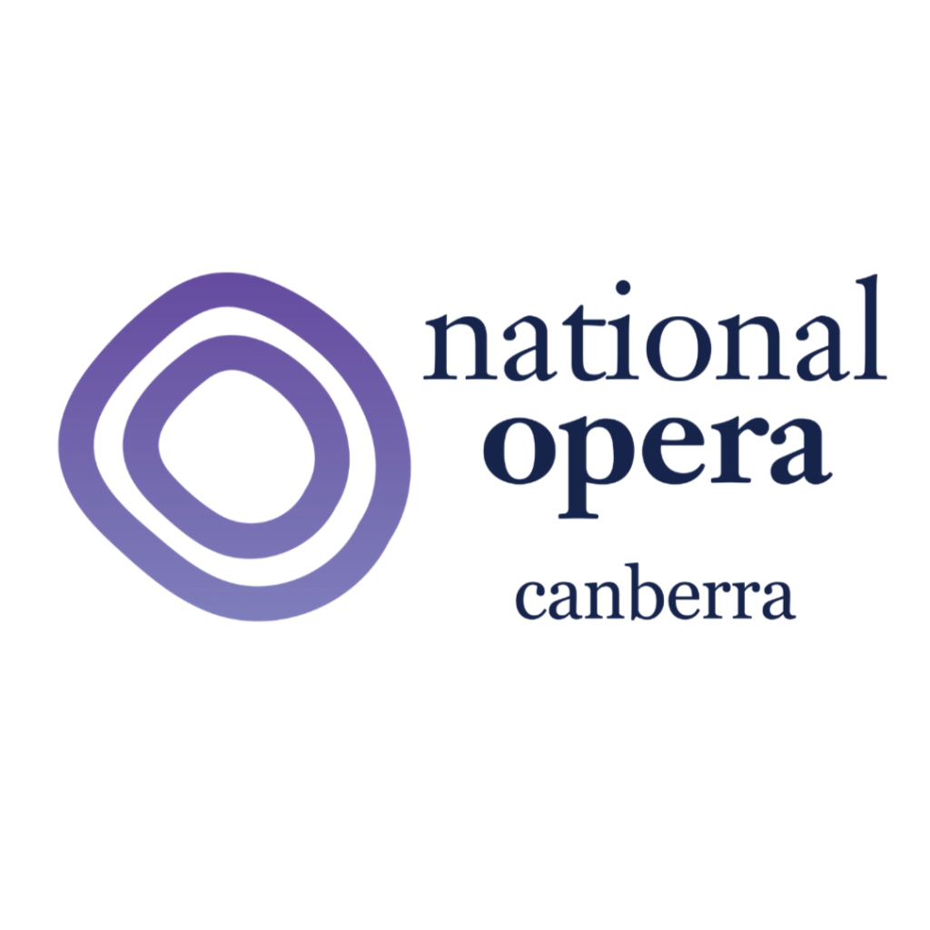 The National Opera Canberra logo. On the left is a stylized emblem made of three concentric, rounded triangular shapes in shades of purple. To the right, the words “national opera” appear in large dark blue lowercase serif lettering, with “Canberra” centred below in smaller matching text. The logo is displayed on a light grey background.